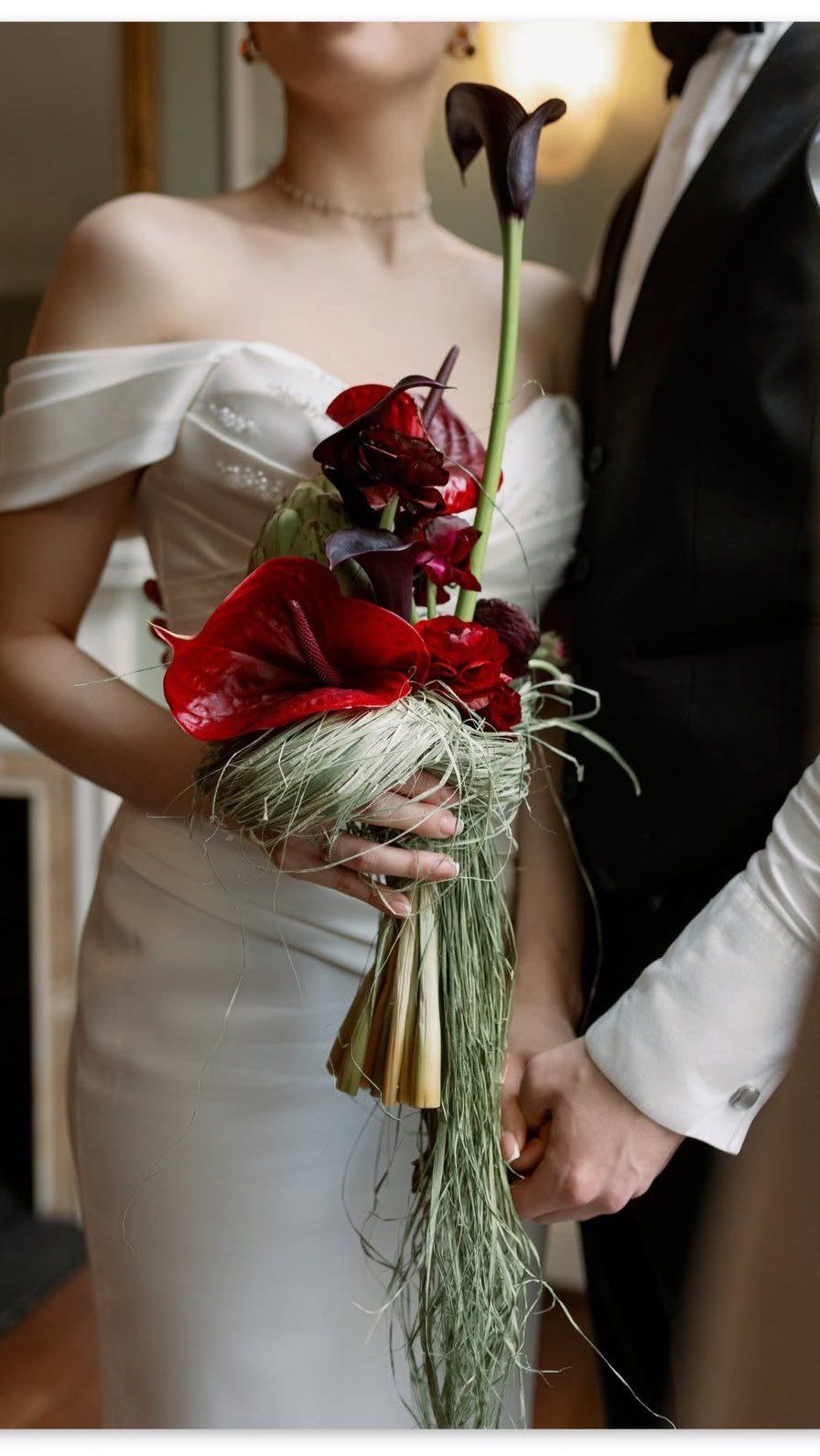 A grand reception room with floral centrepieces